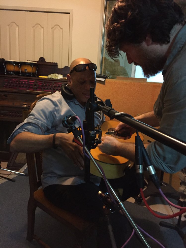 Joby Baker setting up the microphones — those famous sensitive mics